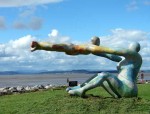 Venus & Cupid, Morecambe Bay, is sub-titled Love, the Most Beautiful of Absolute Disasters
It was commissioned in 2000 by Lancaster Youth and Community services as a community project to create an artwork working with young women from the Ryelands and Marsh areas of Lancaster. Lancaster artist Shane Johnston turned the idea into reality.