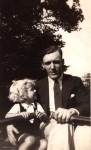 the two Alecs, snr & jnr, with oars in their hands, probably at South Park, Ilford where you could hire boats for the hour - 'Come in nunber nine!' would be shouted when your time was up.