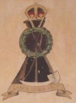 so he hasn't papered over it but has left it as a feature.

Here you can see the three symbols of the Pioneers Corps, a rifle and more importantly a pickaxe and a shovel for these were the sappers, the men who dug the trenches.