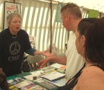 here Joan discussing the issues with a couple of visitors to the stall