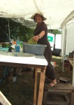 Emily washing up - the sink was exceptionally high off the ground so you had to stand on a step which meant your head touched the roof of the marquee. Though the roof was of no great weight on your head, you tended to lean forward unconsiously to avoid it. Emily's still smiling here so she can't have been washing up long - the crick in the back hadn't set in!