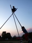 a sillouette of a youngster on top of the tripod which had been erected fairly early on