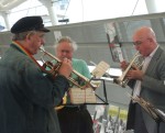trumpets too whilst the musician in green is playing the baritone sax
