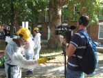 and a man in a white contamination suit with a geiger counter, here checking out a cameraman
