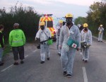when out of the dawn came a group in white contamination suits
