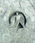 a birdman on another boulder