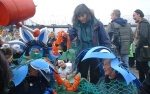 the arrival of the flower brigade brings a smile to the activist in the middle who's been there for hours