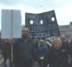leaving Trafalgar Square, strategic holes in banners make them easier to carry in the wind