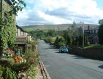 with a final roll downhill to our home on Hollin Hall, Boulsworth Hill in the distance