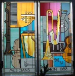 the Mechanics Institute in Manchester -  the Venue of a recent peace conference where there was much talk of the new European Constitution which insists member states spend more on 'Defence'
(a.k.a. 'War' - what a thing to put in a Constitution!.
Here the MUSICIANS stained glass window