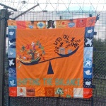 A carefully crafted beautiful banner on the banner on the fence by the North gate
