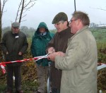 the two MP's cutting the ribbon marking the border, sybolic of reuniting the link between Yorkshire and Lancashire