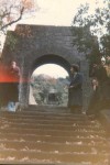 looking across the bridge, friends John & Monica on either side of the impressive gateway. The last of my 1970's photos. All these structures had been built by Lord Leverhulme as a backdrop for his bungalow 1000 feet up on the edge of the moors. He made his money from soap (the company Unilever is a descendant of Lever Brothers) and also built the model village, Port Sunlight, on the banks of the Mersey.