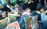 Held at the start of the Labour Party Conference, one of the biggest demonstrations Manchester has ever seen with tens of thousands of protesters. Part of the way a die-in was held and virtually the whole march fell to the floor.
here, part of the die-in, this near Deansgate