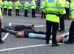 Faslane 365 is a rolling blockade of Britains Nuclear submarine base. My daughter Kerris, grandchildren and I went up with the band 'Seize the Day' and about 60 others. Here, Theo, a singer in the band, is in a lock-in with 2 others at the end of the 2nd day