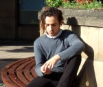i like the curves and shadows with this young man absorbed in his mobile phone