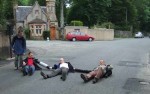 Ah, a nice empty road. 3 activists sit down carefully leaving access available for the children's nursery