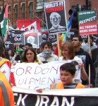 with a young man helping hold the banner