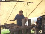 as the artisan makes toadstool treading the pedals to turn the lathe, a bvariety of tools at hand