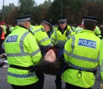 one activist is cut loose and carried away but there's plenty more to follow