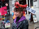 Despite cold rain hundreds of cyclists turned out for the Global Warming Bike Ride in Central London demanding the talks in Bali really make a difference. Following the bike ride we joined the thousands on the March.
Here a cyclist sports picturesque headgear calling for time on unlimited flying.