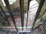 on entering the tower there is a metal staircase to a landing