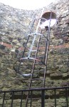 from which this strange contraption of a ladder rises