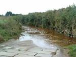 where the road enters the stream