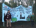a banner & some protesters