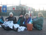 early next day it was time for action - here a sit down in front of the Construction Gate. A couple of us from the Easter London to Aldermaston bike ride used train and cycle to get to the base, most were dropped off by coach & minibus