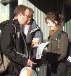 a bit of manual dexterity, taking a leaflet whilst holding a coffee in one hand and a bag in the other