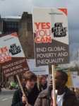 Obama's words 'Yes You Can' were echoed several times on banners and placards - this one calling to end global poverty