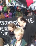 the banner behind reads, 'Can we overthrow the government? 'Yes we can!'
Obama's slogan used again